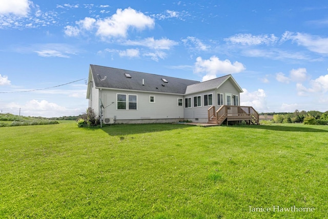 5777 N Broadway, Freeport, MI 49325 - rear view of house with a lawn, crawl space, and a wooden deck