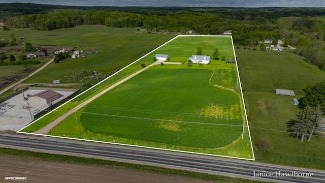 5777 N Broadway, Freeport, MI 49325 - aerial view of sparsely populated area featuring property parcel outlined and a heavily wooded area