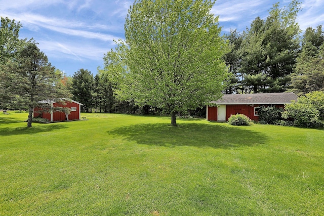 3457 S Keefer Hwy, Lyons, MI 48851 - view of grassy yard featuring an outdoor structure and a pole building