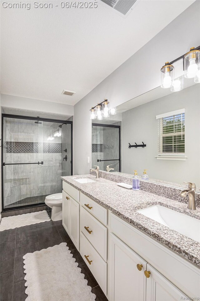 13210 River Bend Dr, Linden, MI 48451 - full bathroom with a stall shower, double vanity, toilet, and tile patterned flooring