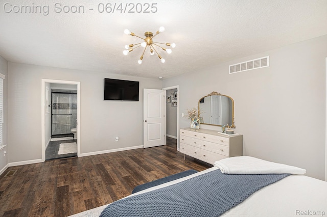 13210 River Bend Dr, Linden, MI 48451 - bedroom featuring dark wood-style flooring, a chandelier, baseboards, ensuite bathroom, and a textured ceiling