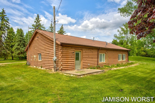 4403 4th St, Caledonia, MI 49316 - back of house with log exterior, a yard, and a shingled roof