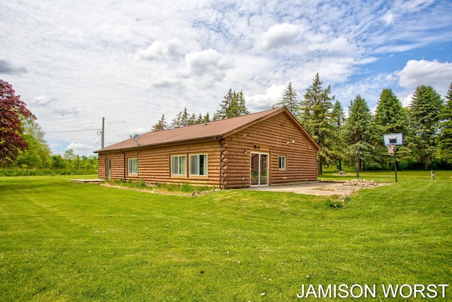 4403 4th St, Caledonia, MI 49316 - rear view of property featuring log siding, a lawn, and a patio area