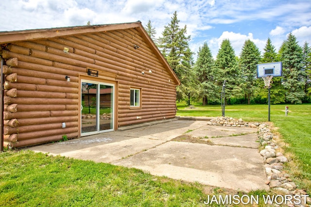 4403 4th St, Caledonia, MI 49316 - back of house with a patio area, a lawn, and log exterior