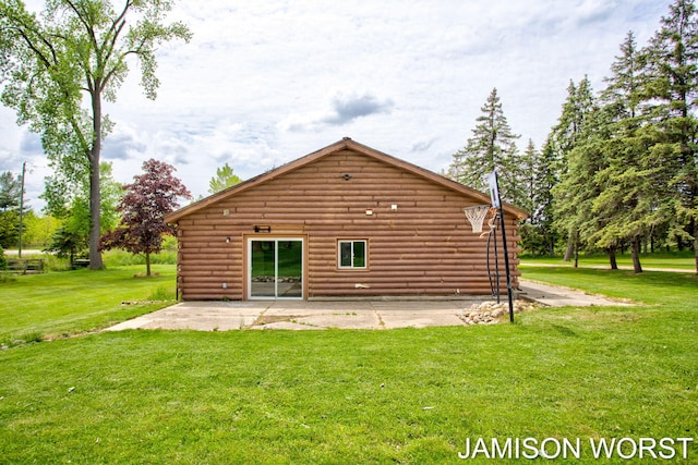 4403 4th St, Caledonia, MI 49316 - back of property featuring log siding, a yard, and a patio