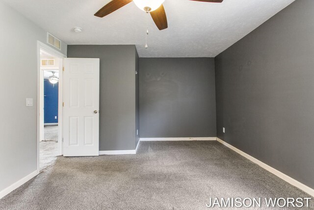 4403 4th St, Caledonia, MI 49316 - spare room featuring ceiling fan, carpet floors, a smoke detector, and baseboards
