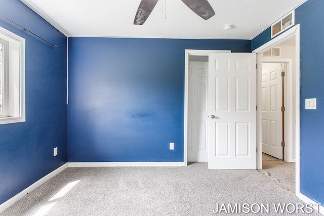 4403 4th St, Caledonia, MI 49316 - unfurnished bedroom featuring carpet flooring, baseboards, and a ceiling fan