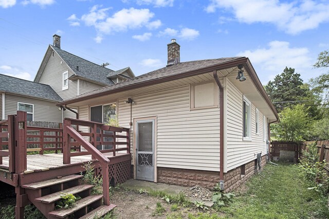 205 Corinne St SW, Grand Rapids, MI 49507 - back of house featuring a deck and a chimney