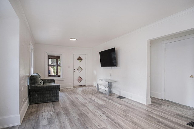 205 Corinne St SW, Grand Rapids, MI 49507 - living area with light wood-type flooring, ornamental molding, and baseboards