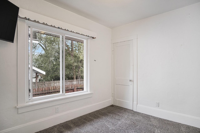 205 Corinne St SW, Grand Rapids, MI 49507 - unfurnished room featuring dark colored carpet and baseboards