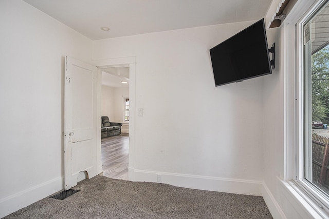 205 Corinne St SW, Grand Rapids, MI 49507 - spare room featuring carpet flooring, plenty of natural light, and baseboards