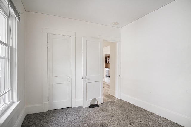 205 Corinne St SW, Grand Rapids, MI 49507 - unfurnished bedroom with carpet and baseboards