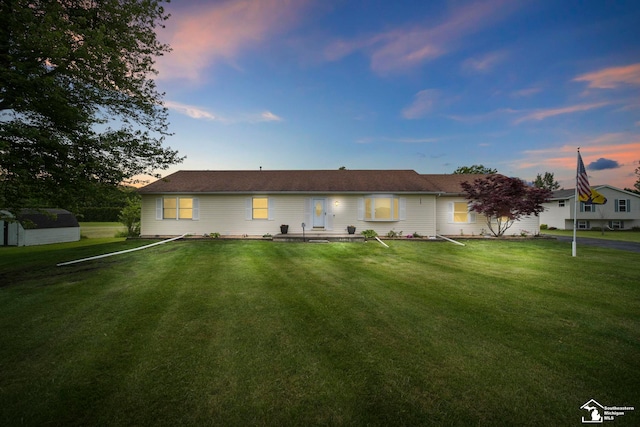214 Roosevelt St, Dundee, MI 48131 - view of front facade featuring a front lawn