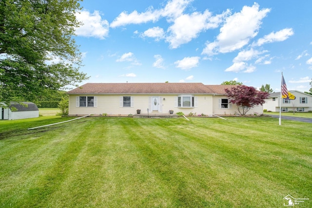214 Roosevelt St, Dundee, MI 48131 - rear view of property featuring a lawn