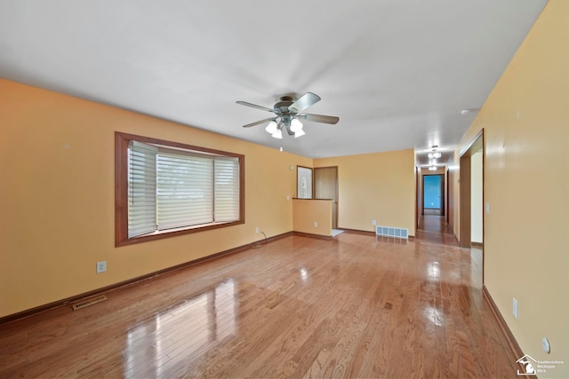 214 Roosevelt St, Dundee, MI 48131 - empty room featuring ceiling fan, light wood-style flooring, and baseboards