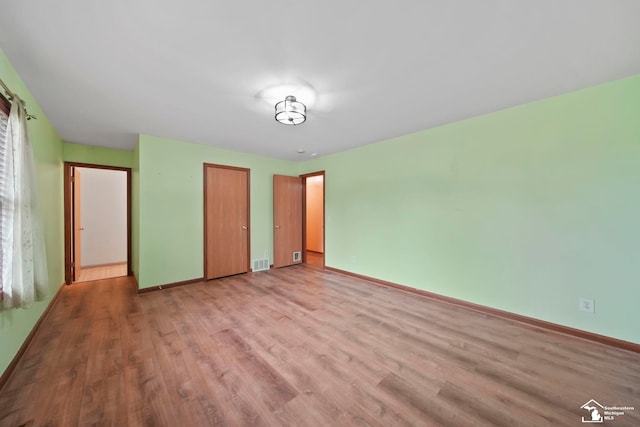 214 Roosevelt St, Dundee, MI 48131 - unfurnished bedroom with light wood-style flooring, baseboards, and a closet