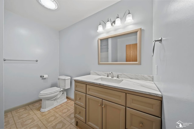 214 Roosevelt St, Dundee, MI 48131 - bathroom featuring baseboards, vanity, toilet, and tile patterned floors
