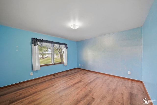 214 Roosevelt St, Dundee, MI 48131 - spare room featuring wood finished floors and baseboards