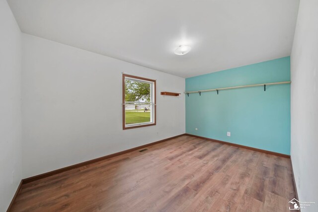214 Roosevelt St, Dundee, MI 48131 - unfurnished room featuring wood finished floors and baseboards