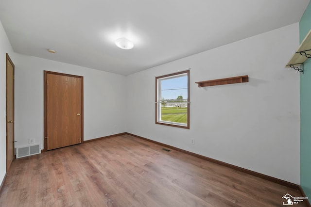 214 Roosevelt St, Dundee, MI 48131 - unfurnished bedroom with wood finished floors and baseboards