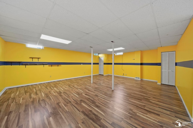 214 Roosevelt St, Dundee, MI 48131 - finished basement featuring wood finished floors, baseboards, and a paneled ceiling