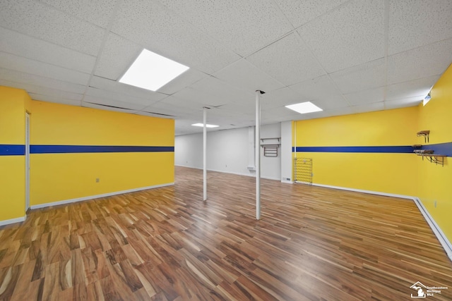 214 Roosevelt St, Dundee, MI 48131 - below grade area with wood finished floors, baseboards, and a drop ceiling