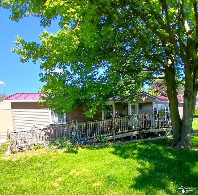 9361 Exeter Rd, Carleton, MI 48117 - view of green lawn featuring a wooden deck