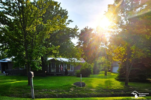 9361 Exeter Rd, Carleton, MI 48117 - view of front of house with a front yard and a detached garage