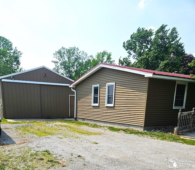 9361 Exeter Rd, Carleton, MI 48117 - view of home's exterior featuring a pole building and an outdoor structure