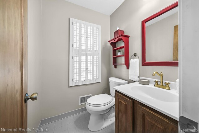 892 Hemlock Ct, Rochester, MI 48307 - bathroom with vanity, toilet, tile patterned floors, and baseboards