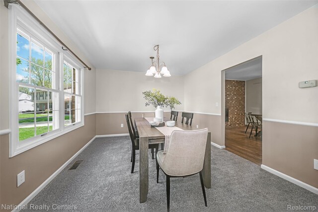892 Hemlock Ct, Rochester, MI 48307 - carpeted dining room with a chandelier and baseboards
