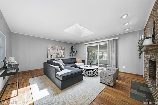 892 Hemlock Ct, Rochester, MI 48307 - living room with wood-type flooring, a skylight, a fireplace, and crown molding