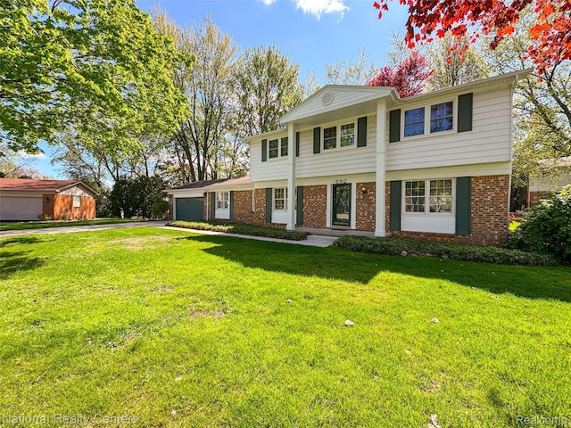 892 Hemlock Ct, Rochester, MI 48307 - view of front of house with asphalt driveway, an attached garage, brick siding, and a front lawn