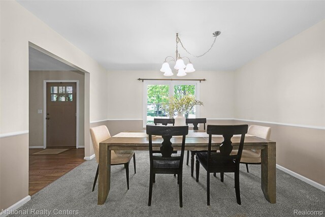 892 Hemlock Ct, Rochester, MI 48307 - dining room with a chandelier, carpet flooring, and baseboards