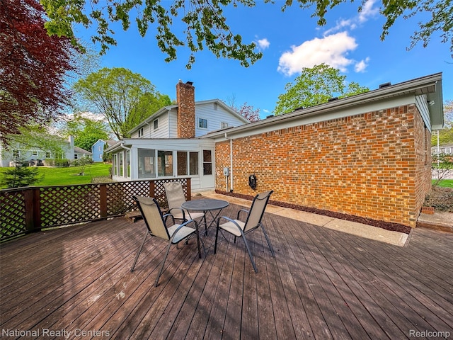 892 Hemlock Ct, Rochester, MI 48307 - wooden deck with a sunroom and outdoor dining space