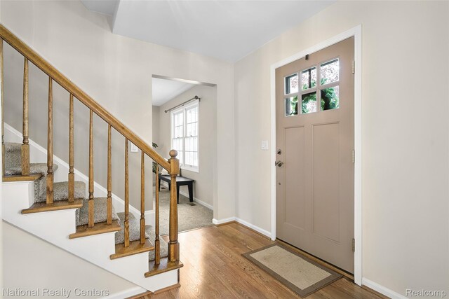 892 Hemlock Ct, Rochester, MI 48307 - foyer entrance featuring plenty of natural light, wood finished floors, and stairs