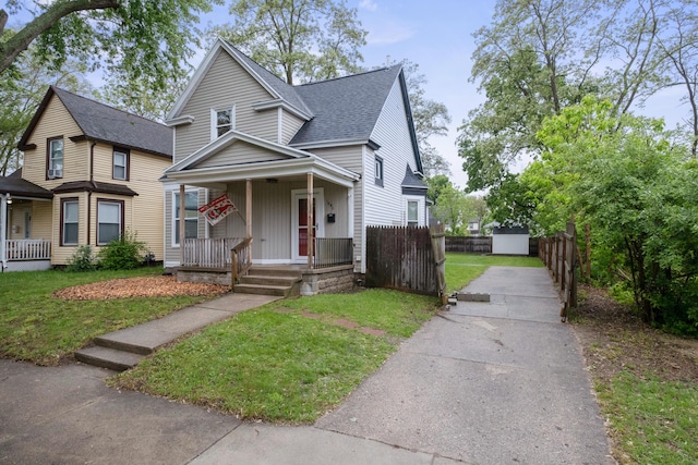 1645 College Ave SE, Grand Rapids, MI 49507 - view of front of home with a porch, roof with shingles, and driveway