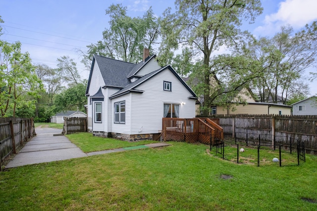 1645 College Ave SE, Grand Rapids, MI 49507 - rear view of property featuring a deck, a chimney, and a shingled roof