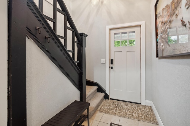 1645 College Ave SE, Grand Rapids, MI 49507 - tiled entryway with stairway and baseboards