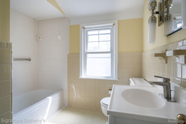 1205 S Bates St, Birmingham, MI 48009 - full bathroom with tile walls, toilet, vanity, tile patterned flooring, and tub / shower combination