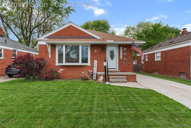 25305 Ursuline St, Saint Clair Shores, MI 48081 - bungalow-style house featuring a front yard and brick siding