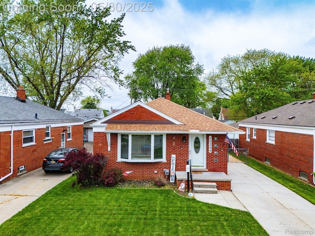 25305 Ursuline St, Saint Clair Shores, MI 48081 - bungalow-style house with brick siding, concrete driveway, a front yard, a chimney, and roof with shingles