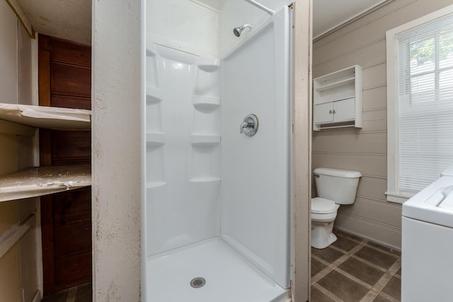 617 Wheaton Ave, Kalamazoo, MI 49008 - bathroom featuring toilet, a shower stall, and washer / dryer