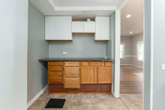 617 Wheaton Ave, Kalamazoo, MI 49008 - kitchen featuring baseboards, dark countertops, white cabinetry, and recessed lighting