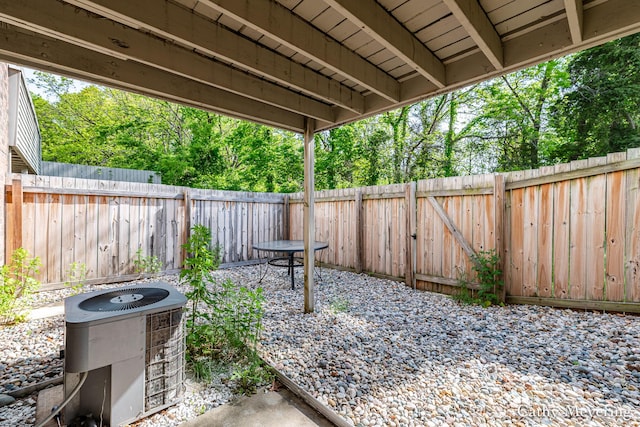 6387 Wainscot Dr SE Unit 102, Grand Rapids, MI 49546 - fenced backyard featuring central AC unit and a patio