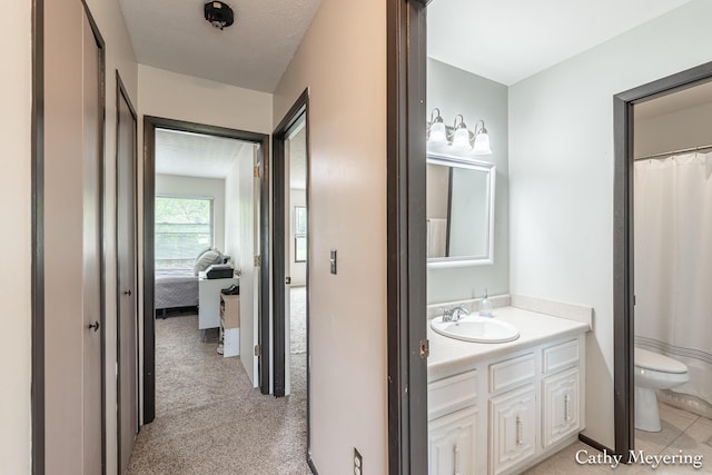 6387 Wainscot Dr SE Unit 102, Grand Rapids, MI 49546 - bathroom featuring toilet, vanity, and ensuite bathroom