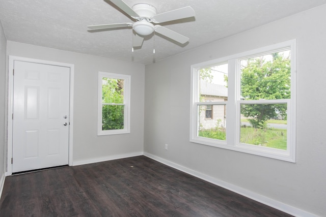 1226 Shakespeare Ave, Kalamazoo, MI 49001 - spare room featuring baseboards, dark wood-style floors, and ceiling fan