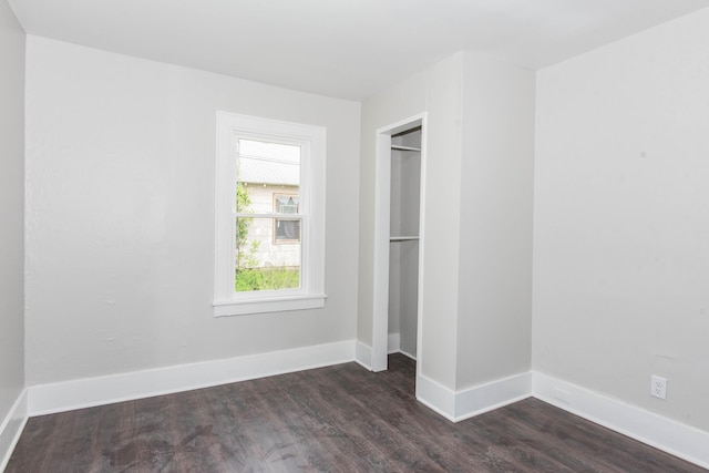 1226 Shakespeare Ave, Kalamazoo, MI 49001 - unfurnished bedroom featuring dark wood-style floors, a closet, and baseboards