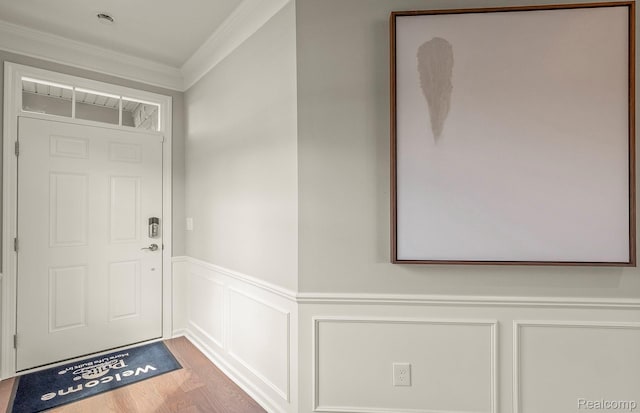 103 Addison Cir, Walled Lake, MI 48390 - entryway with crown molding, wainscoting, wood finished floors, and a decorative wall