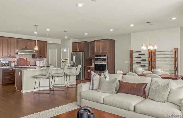 103 Addison Cir, Walled Lake, MI 48390 - living area with a chandelier, dark wood-type flooring, and recessed lighting